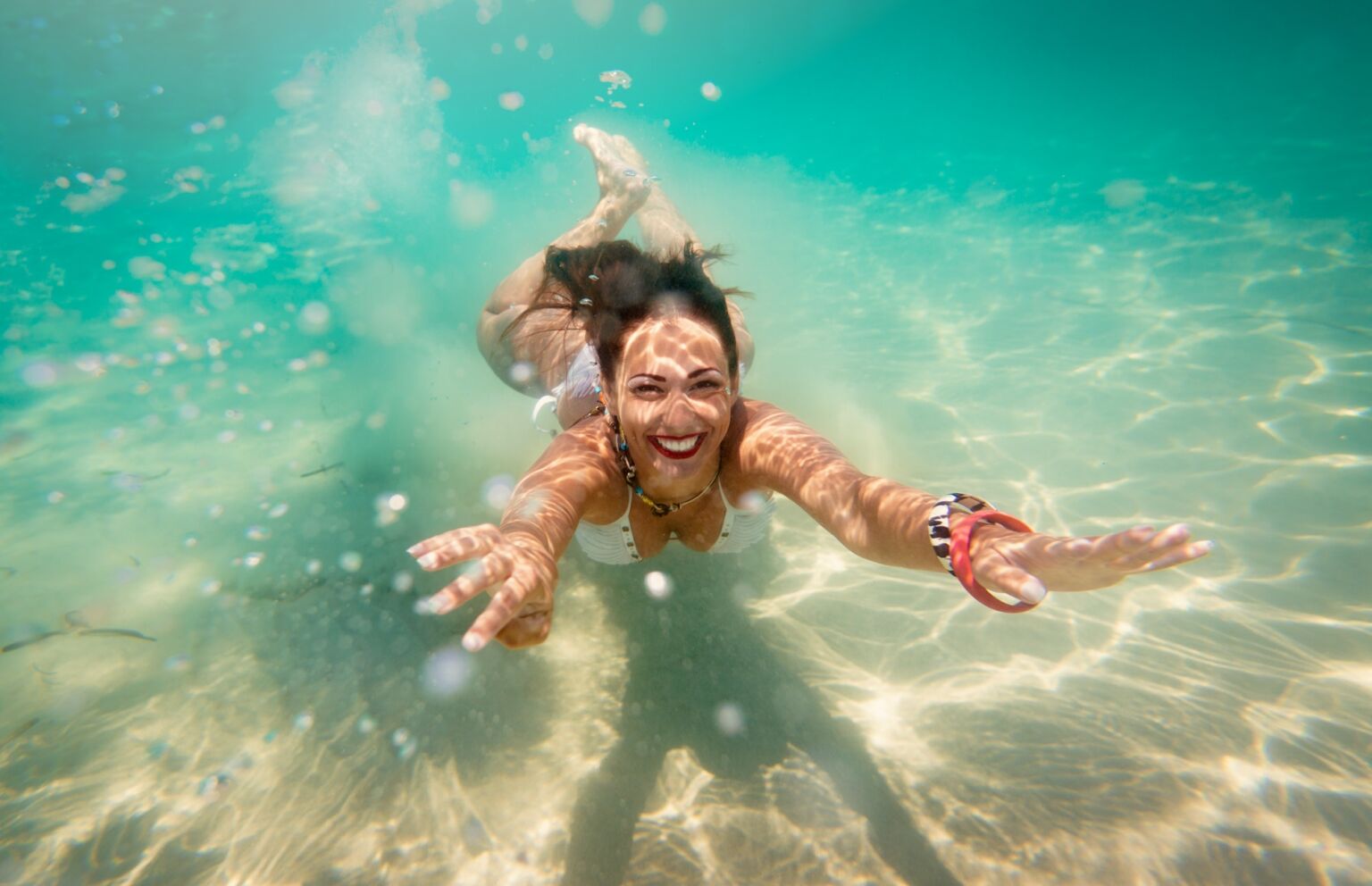 Cute Girl Swimming Under Sea